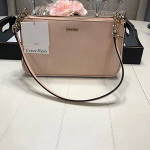 Peach/pink mini Calvin Klein purse. New with tag.